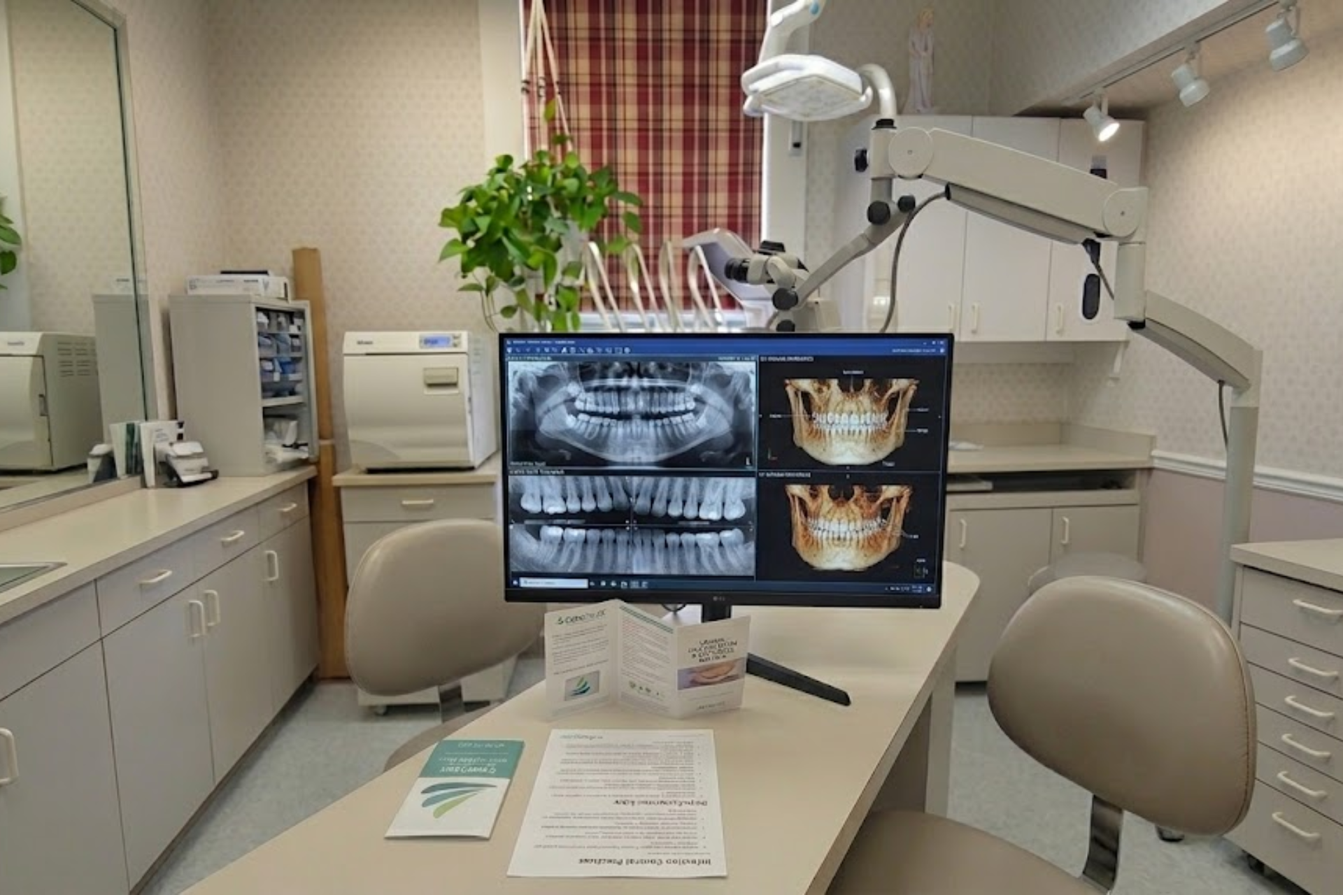 A professional dental workstation in Shelton, CT, displaying high-resolution digital X-rays and 3D jaw reconstructions for precise treatment planning.