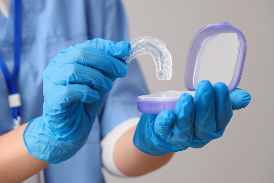 Detailed view of a custom porcelain inlay being prepared to restore a damaged molar tooth.